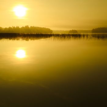 Sunrise at the lake in eastern part of Finland