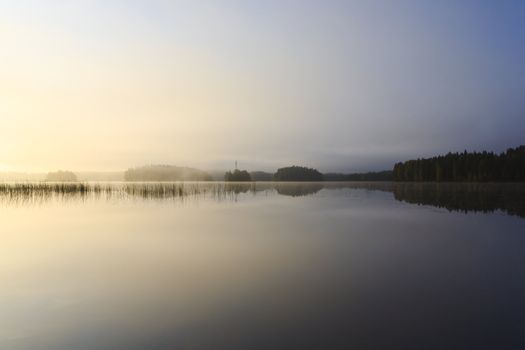 Sunrise at the lake in eastern part of Finland