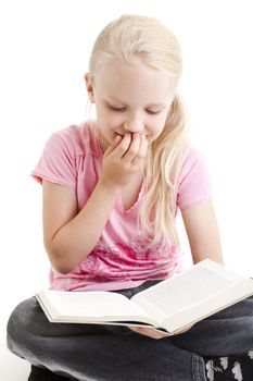Young girl reading funny book over white background