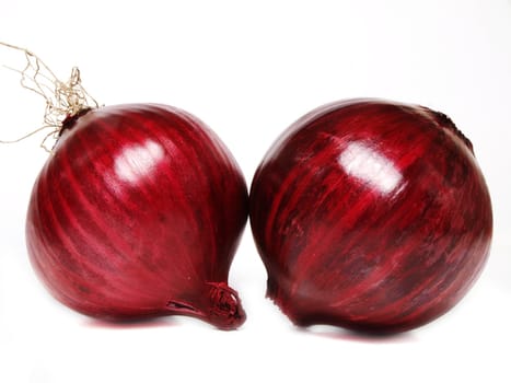 Couple of whole red onion, towards white background