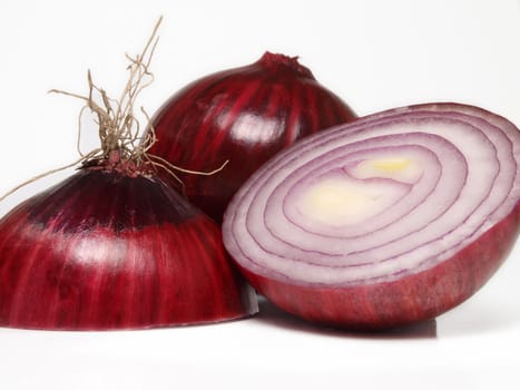 Red onion sliced in a group, towards white background