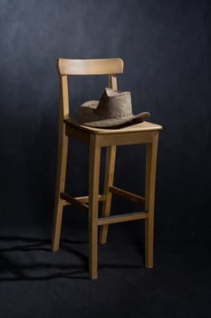 wooden lacquered chair and western hat
