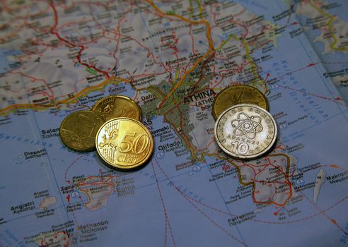Greek map with coins Euro and Drachma