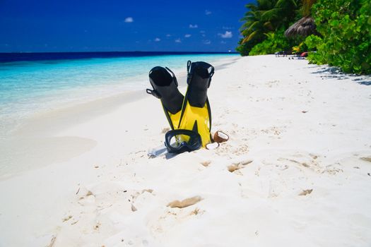 snorekl equipment on white sand beach at Maldives