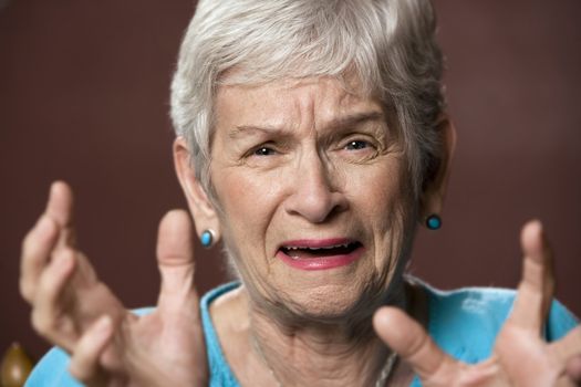 Upset senior with a worried expression on her face