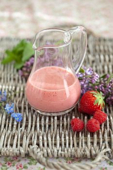 Delicious smoothie with strawberries and raspberries