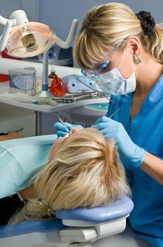 dentistry, doctor and patient, tooth cavity filling 