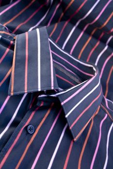 Details of the male black shirt with colorful lines