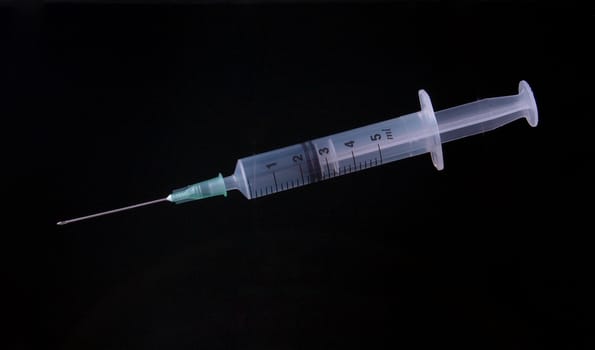 Hypodermic syringe and needle used for immunization.