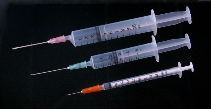 Hypodermic syringe and needle used for immunization.