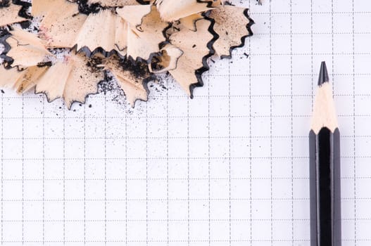 The black pencil and wood shavings background