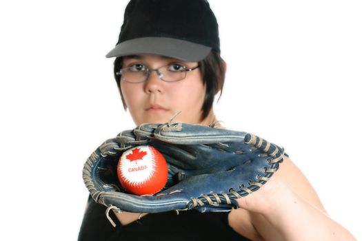 A young girl holding a Canadian baseball with a mitt, isolated against a white background.