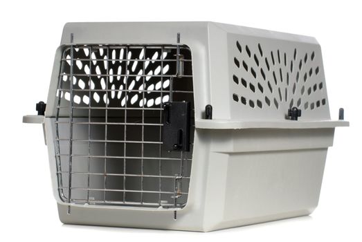 A grey cat carrier with the door closed, isolated against a white background.
