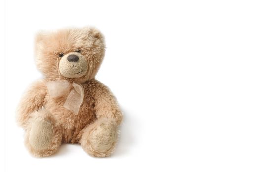 Old small teddie bear isolated on white background