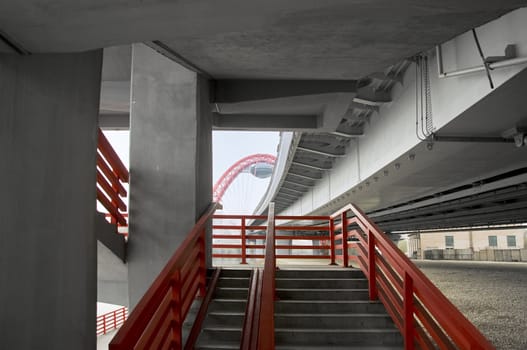 view on the Stairway under concrete road bridge with column in Moscow