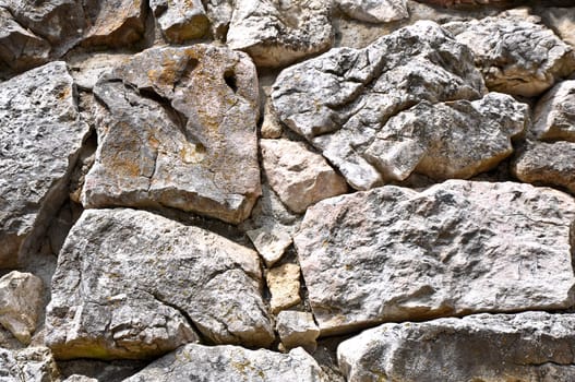 natural yellow-grey texture background of stone with cracks