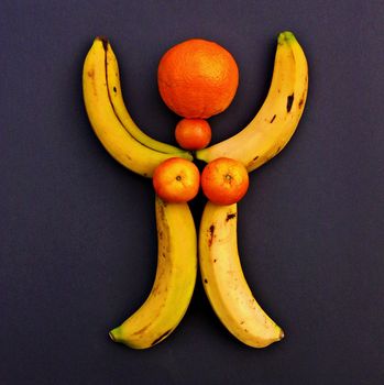 Conceptual female shape, made with imperfect fruits (orange, tangerines and bananas).