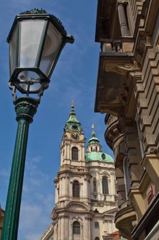 The old street lamp at the Prague street overlooking the clock tower