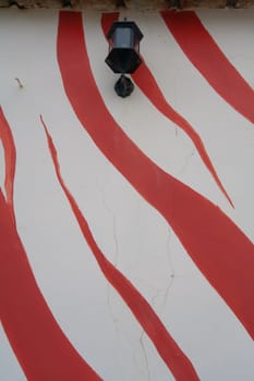 Art painted wall with old street lamp