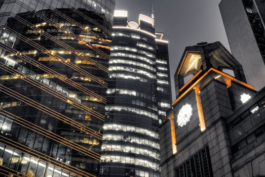 Office night with building and tower in modern city in Hong Kong.