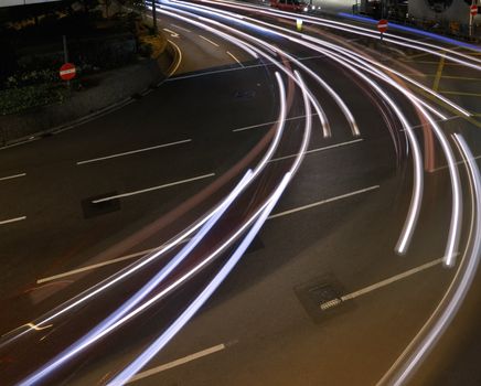 Car light trace in night of modern city.