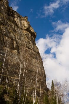 Rocky rock on a background of the sky