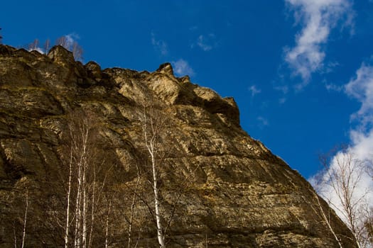 Rocky rock on a background of the sky