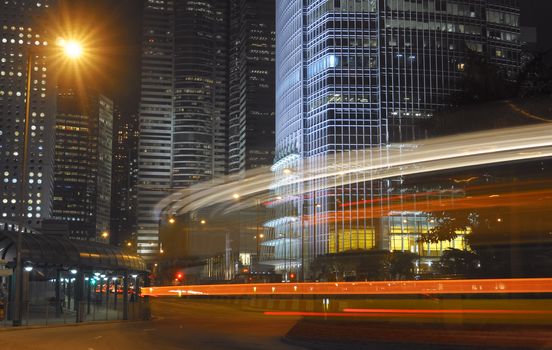Modern city night with car motion blurred.