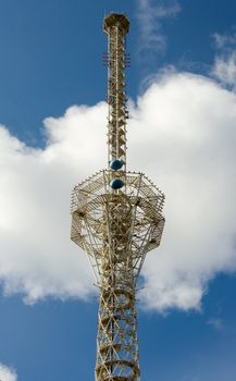 Television tower on a background of clouds