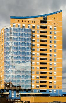 A under construction skyscraper on a background of the sky