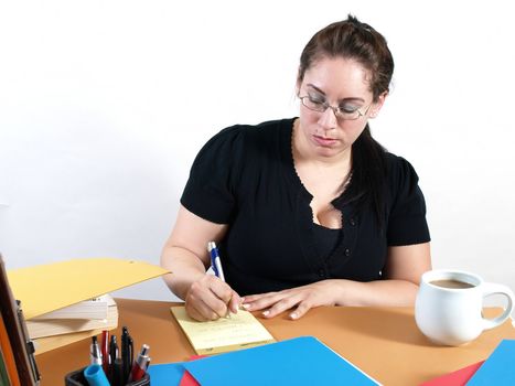 An office assistant writes the daily agenda on a notepad. Over a white background.