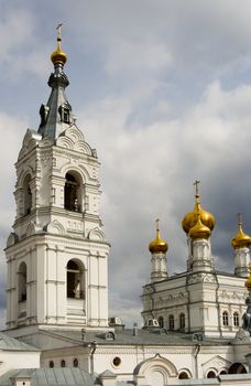 Christian temple with domes on a background of clouds