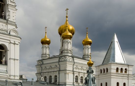 Christian temple with domes on a background of clouds
