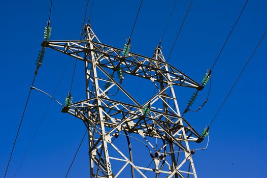 High voltage power lines and blue sky