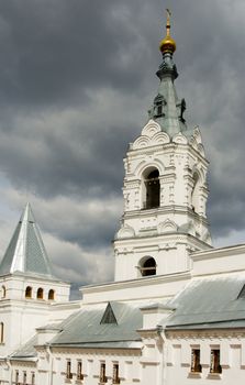 Christian temple with domes on a background of clouds