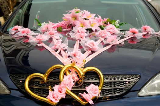 The decorated wedding car.