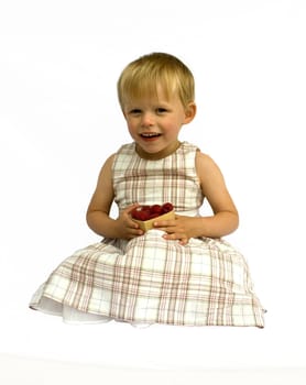 Girl holding a box full of raspberries, isolated on white background