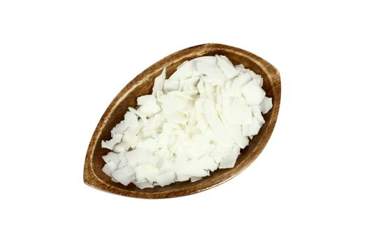 Wooden bowl full of coconut chips, isolated on white