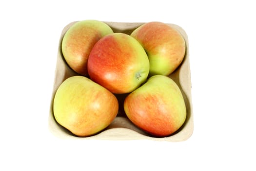 Ripe fresh apple in a karton container, isolated