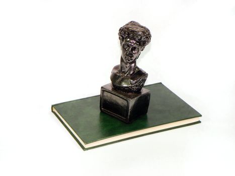 statue and book isolated