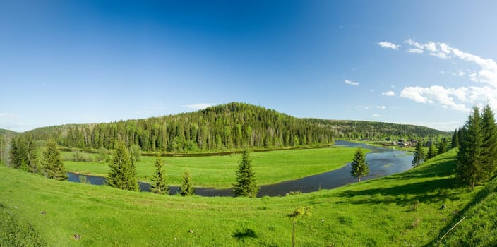 Summer landscape. Village on the river. Panorama.