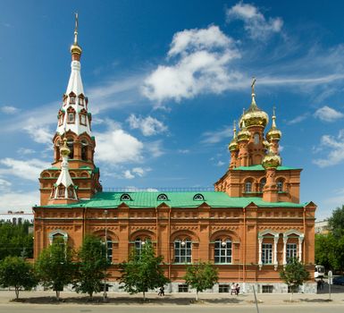 Christian temple with domes on a background of clouds