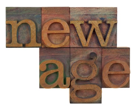 new age in vintage wood letterpress type, stained by color ink, isolated on white