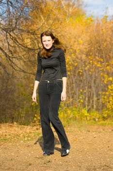 The young girl against autumn nature