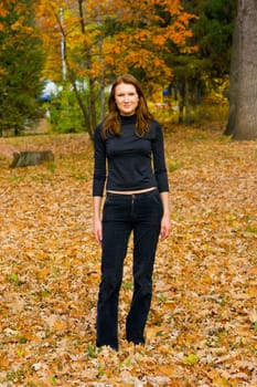 The young girl against autumn nature