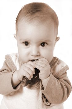 tot and cucumber,small boy eats fresh cucumber.tone sepia