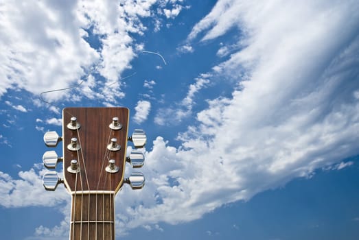 Guitar on cloudy sky bakcground!