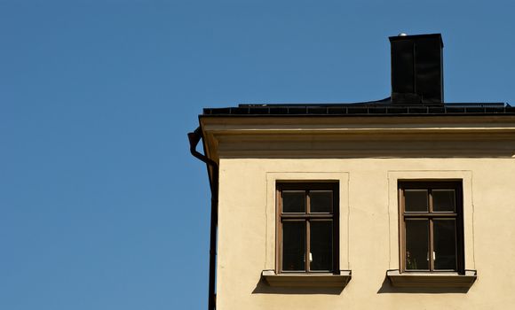 Detail of a residential house with blue sky