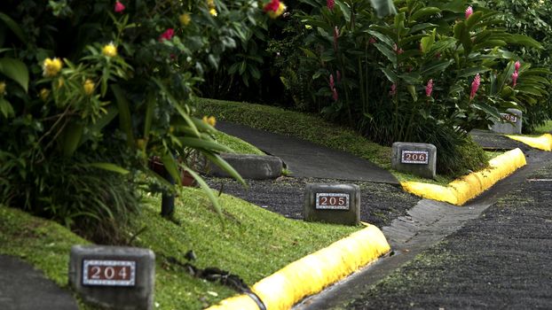 Numbers at the road curb marking the house numbers