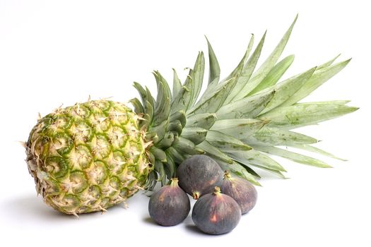 Fresh ananas and figs isolated on white background. 